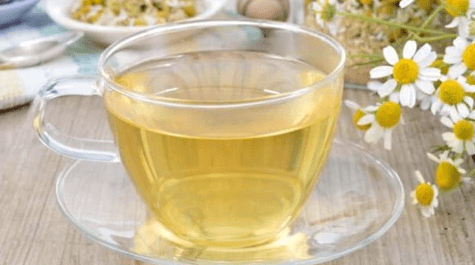 weaverscoffee.sbs Glass tea cup and saucer of Chamomile Herbal Tea.