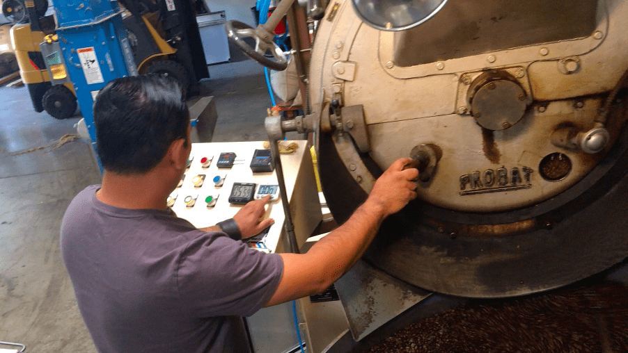 weaverscoffee.sbs Man roasting Guatemala Antigua Coffee on a Probat Coffee Roaster.